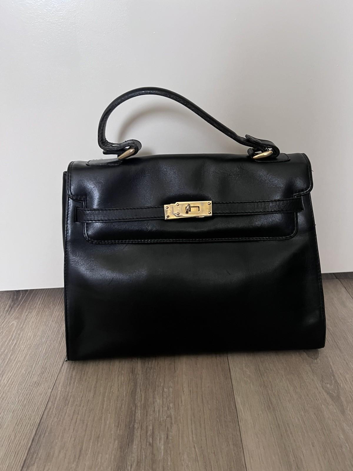 Vintage leather handbag made in Spain with golden elements